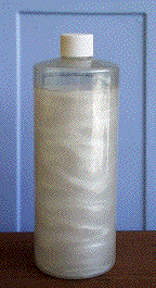 Rheoscopic fluid in  a liquid-filled cylinder