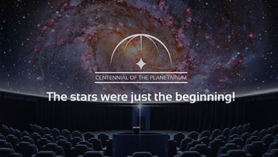 theater seating with the universe projected on the screen